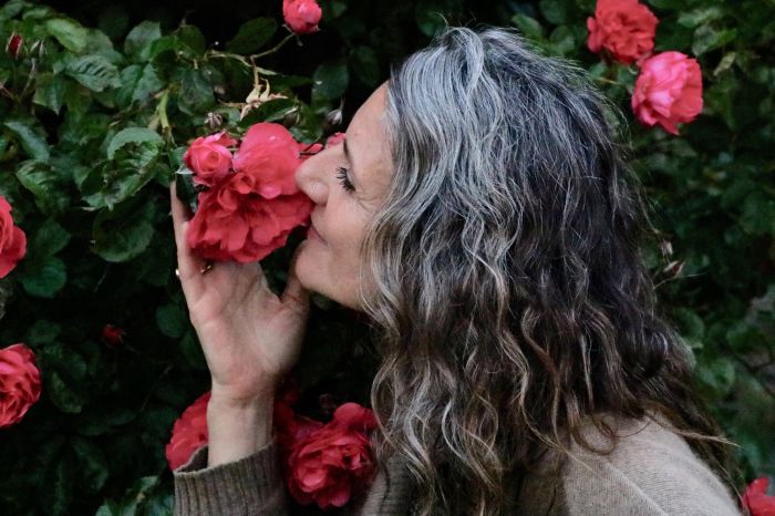 Erika-smelling-a-rose
